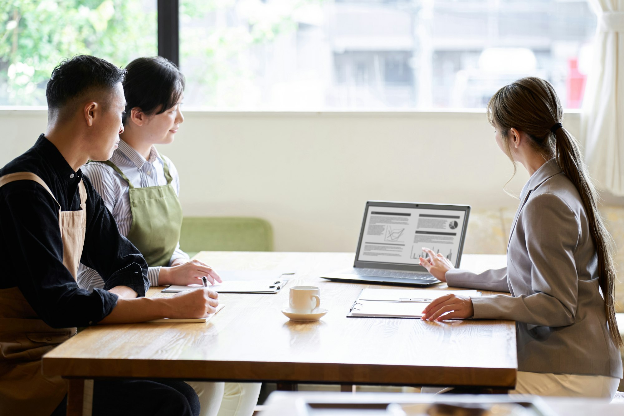 Asian business woman selling to restaurant owners